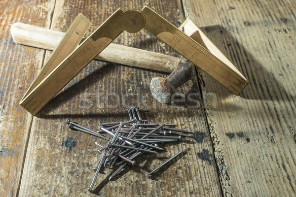 Vintage hamer nagels houten centimeter plank Stockfoto © deyangeorgiev