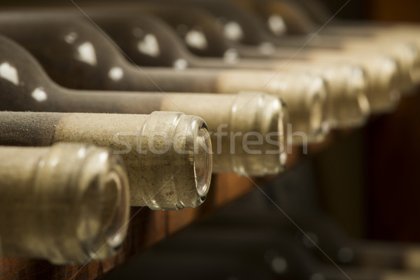 Wine bottles on shelf Stock photo © deyangeorgiev