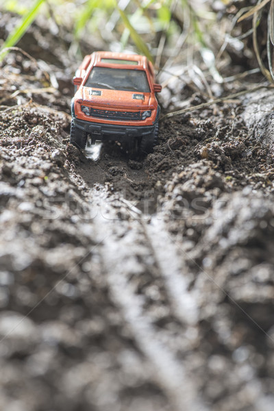 Small red off road car toy in the nature. Stock photo © deyangeorgiev