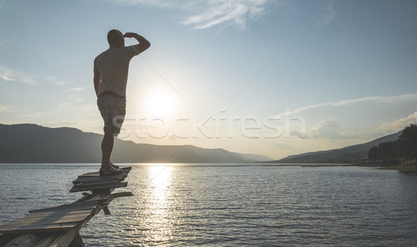 Boy in front of mountain lake Stock photo © deyangeorgiev