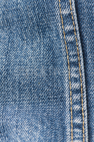 Orange stitch on the denim garment Stock photo © deyangeorgiev