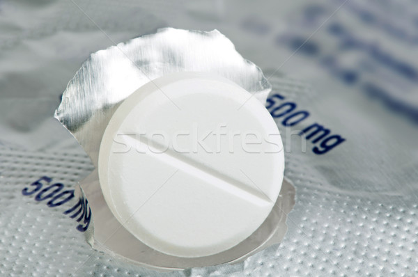 Stock photo: White pill in a pack very close up