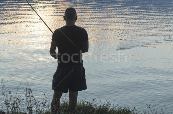Silueta pescador montana deporte puesta de sol verano Foto stock © deyangeorgiev