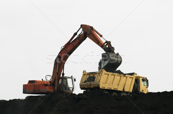 Escavadora caminhão branco isolado construção trabalhar Foto stock © deyangeorgiev