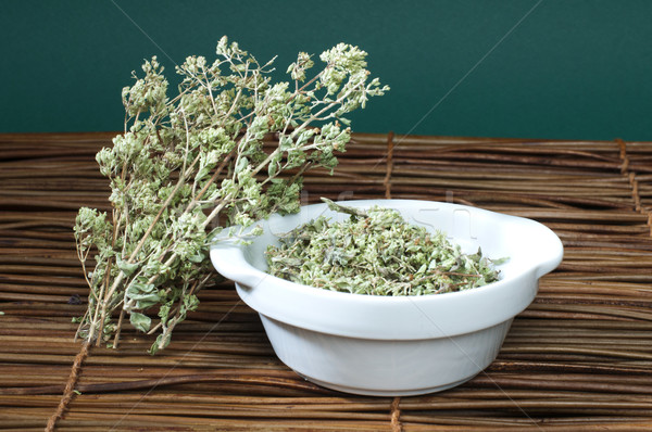 Dried oregano in a bowl Stock photo © deyangeorgiev