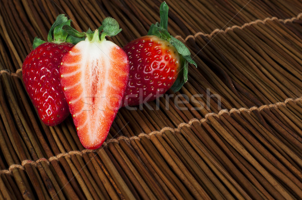 Strawberries on wooden base Stock photo © deyangeorgiev