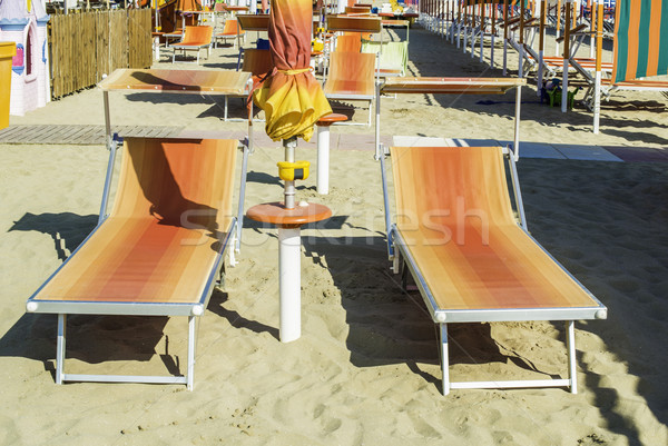 Sunbeds and umbrellas on the beach Stock photo © deyangeorgiev