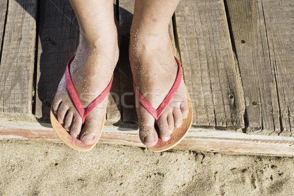 Stock photo: Women foots on the beach