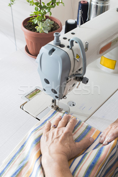 Women sew on sewing machine Stock photo © deyangeorgiev