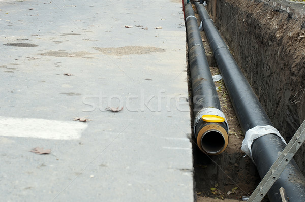 Installing pipes for hot water and steam heating Stock photo © deyangeorgiev