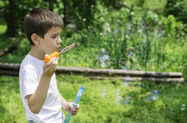 Stok fotoğraf: çocuk · kabarcıklar · yeşil · park · yüz · güneş