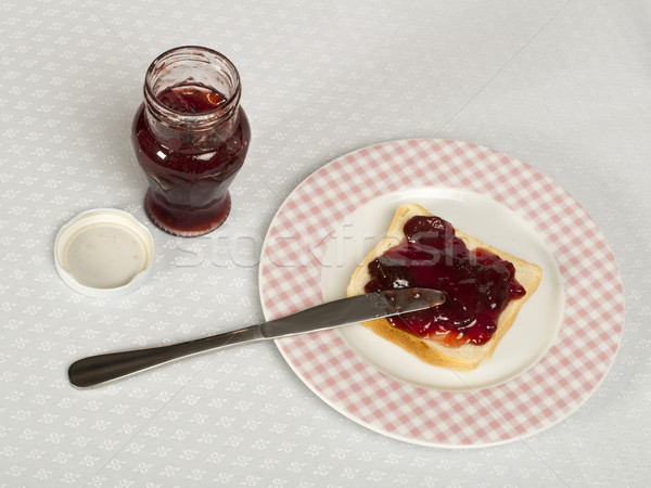 Stock photo: Spread jam on bread