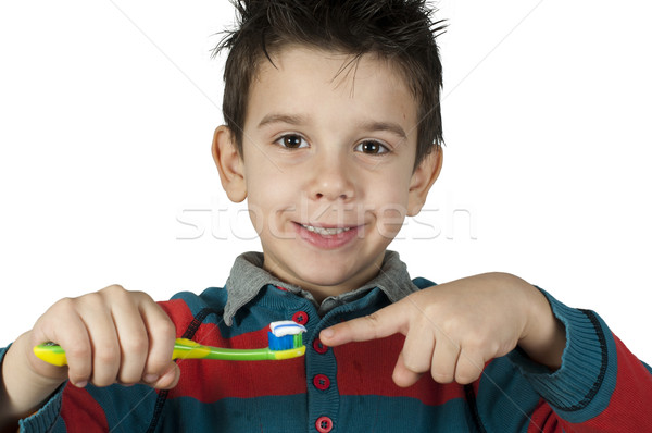 Boy brushing his teeth Stock photo © deyangeorgiev