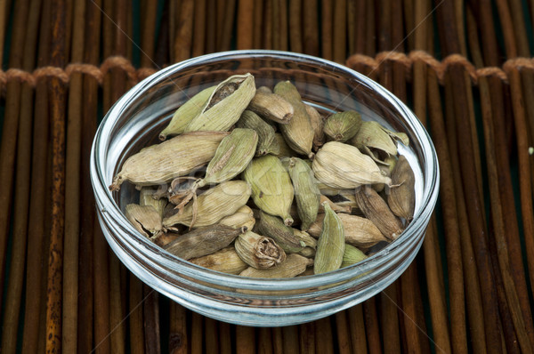 Dried cardamon in a bowl  Stock photo © deyangeorgiev