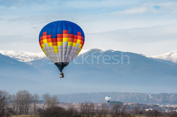 Multicolored Balloon in the blue sky Stock photo © deyangeorgiev
