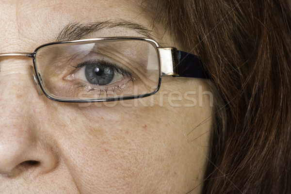 Close up old women eye and glasses Stock photo © deyangeorgiev