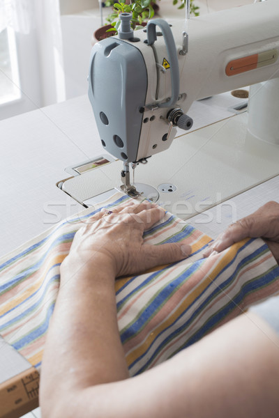 Women sew on sewing machine Stock photo © deyangeorgiev