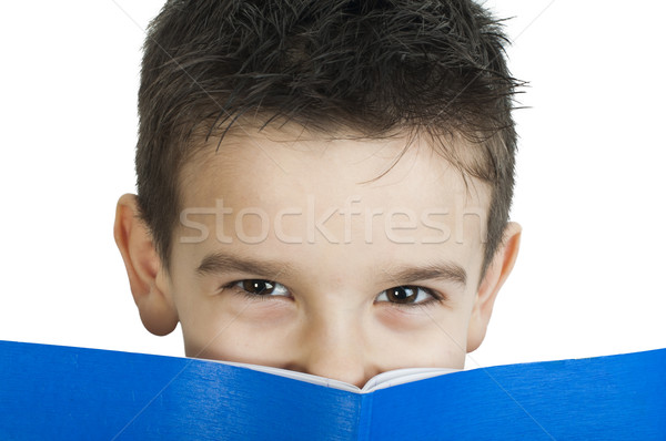 Child with notebook in front of the face Stock photo © deyangeorgiev