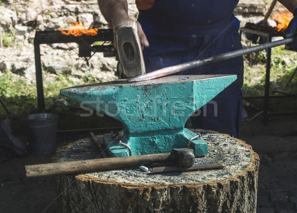 Blacksmith forges iron on anvil Stock photo © deyangeorgiev
