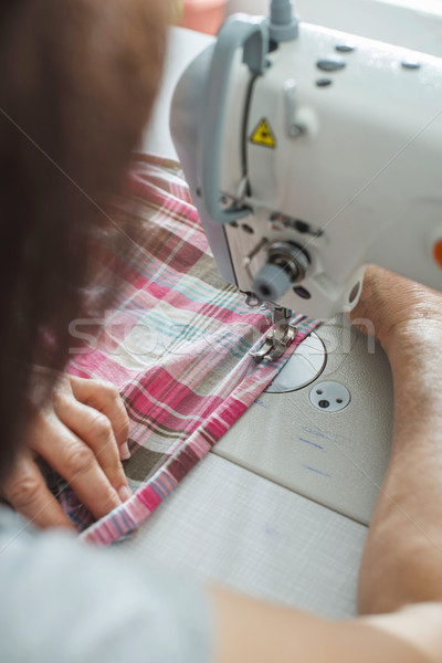 Women sew on sewing machine Stock photo © deyangeorgiev