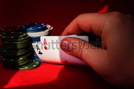 Two aces high on red table with chips Stock photo © deyangeorgiev