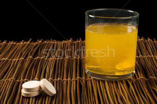 Stock photo: Vitamins pills soluble in water