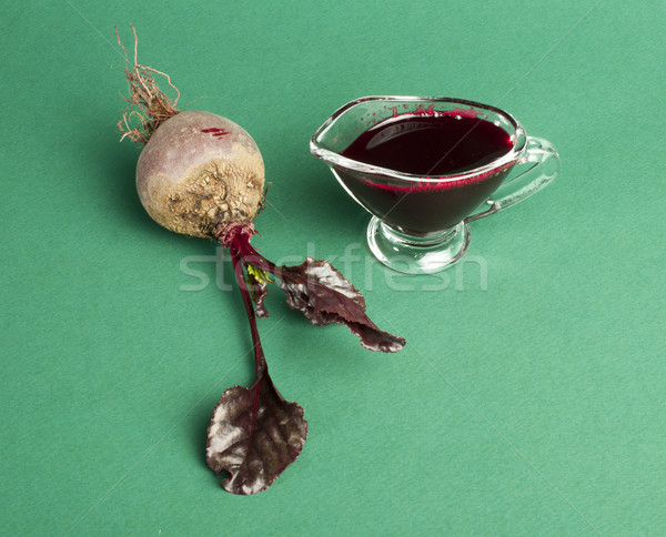 Red beets with leaves and jug with juice Stock photo © deyangeorgiev