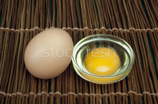 Broken in half raw egg and yolk inside Stock photo © deyangeorgiev