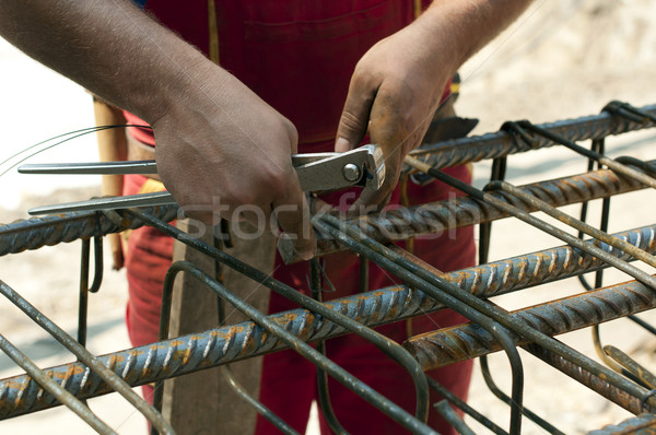 Construction worker ties reinforcing steel Stock photo © deyangeorgiev