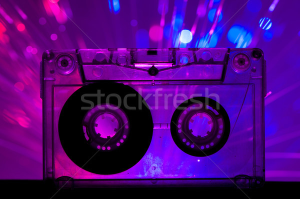 Stock photo: Transparent Cassette tape and disco light background