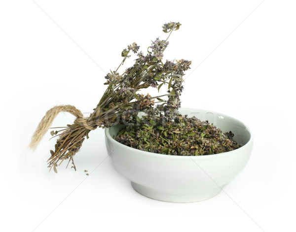 Dried thyme in a bowl and thyme twigs Stock photo © deyangeorgiev