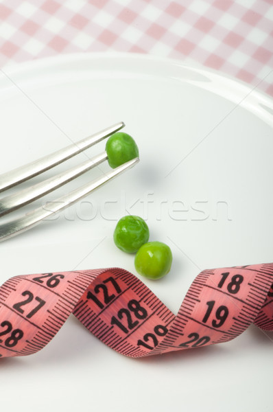 Plate with peas and centimeter measure Stock photo © deyangeorgiev