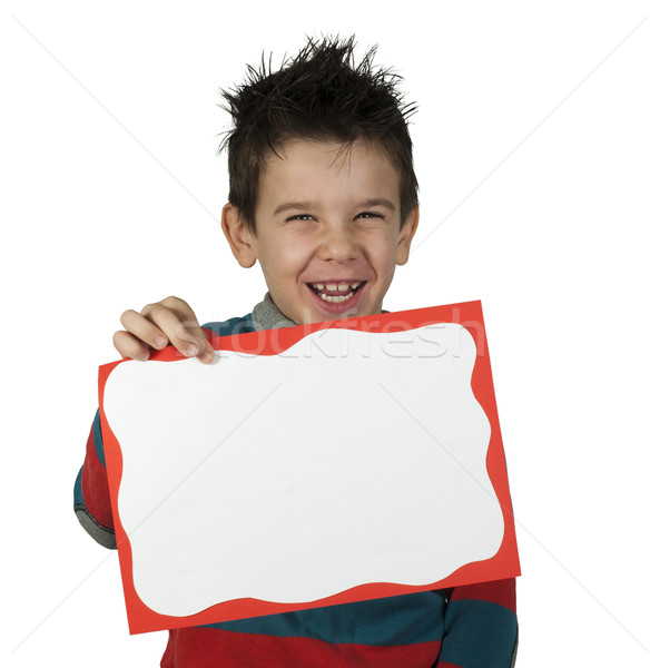 Stock photo: Boy who laughs and holds white board