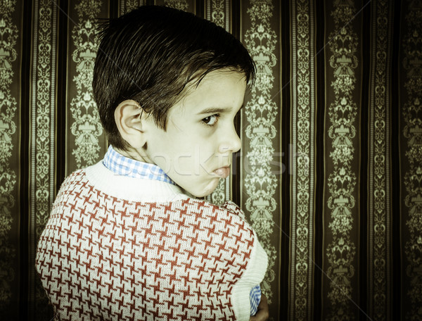 Frowning child vintage clothes. Stock photo © deyangeorgiev