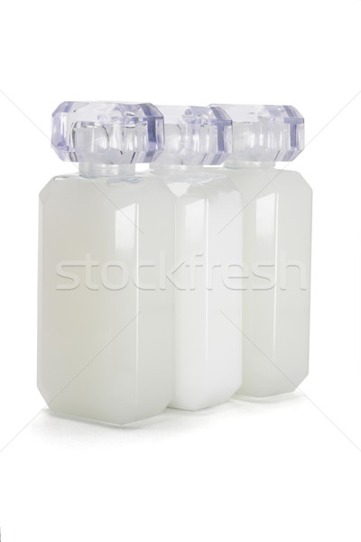Három üveg üvegek piperecikkek fehér haj Stock fotó © dezign56