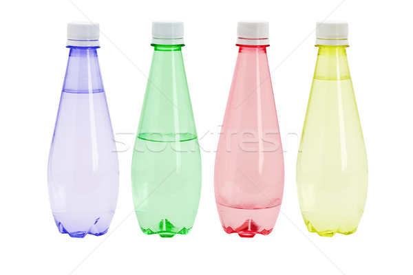 Woda mineralna kolorowy plastikowe butelek biały pić Zdjęcia stock © dezign56