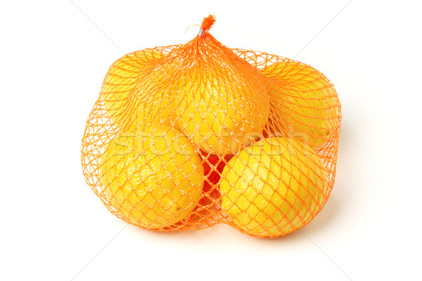 Fresh lemons in plastic sack Stock photo © dezign56