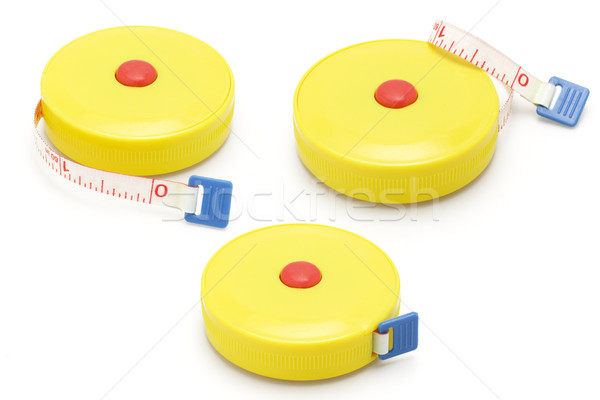 Three yellow plastic measuring tapes Stock photo © dezign56