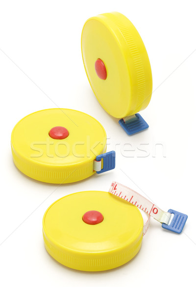 Three yellow measuring tapes Stock photo © dezign56