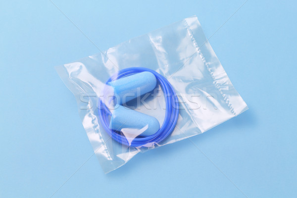 [[stock_photo]]: Oreille · plastique · sac · bleu · fond · sonores