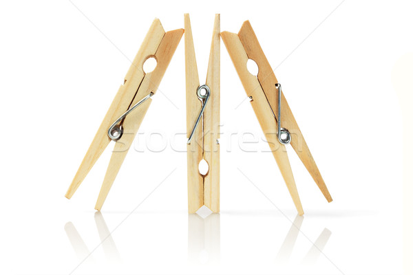 Három fából készült ruházat áll fehér szerszám Stock fotó © dezign56