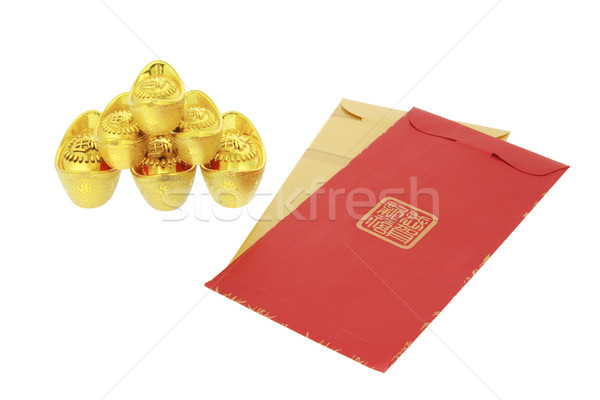 Chinese lunar New Year red packets and gold ingots Stock photo © dezign56