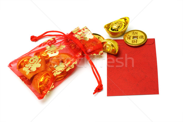 Gold ingots and coins in red sachet and red packet Stock photo © dezign56