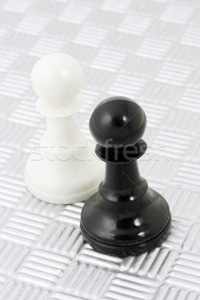 White pawn and black rook Stock photo © dezign56