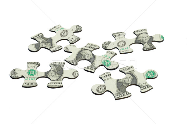 Jigsaw puzzles and US dollar note Stock photo © dezign56