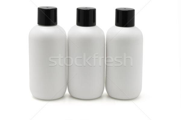 Három fehér műanyag üvegek csetepaté test Stock fotó © dezign56