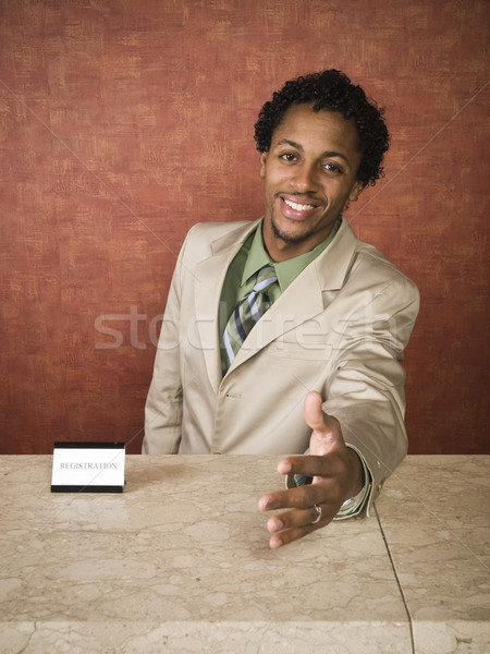 Hotel receptionist dipendente sorriso uomo imprenditore Foto d'archivio © dgilder