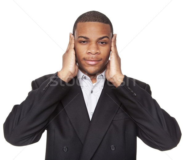 Stock photo: Hear No Evil - African American businessman isolated on white