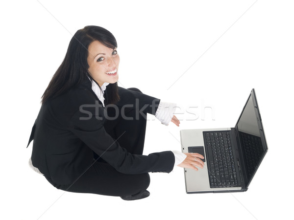 Kobieta interesu posiedzenia laptop odizolowany Zdjęcia stock © dgilder