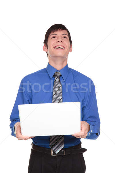 Expressions - Caucasian businessman laughing out loud at his com Stock photo © dgilder